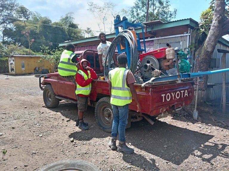 Crew and machinery being mobilised to a new site on a Toyota truck