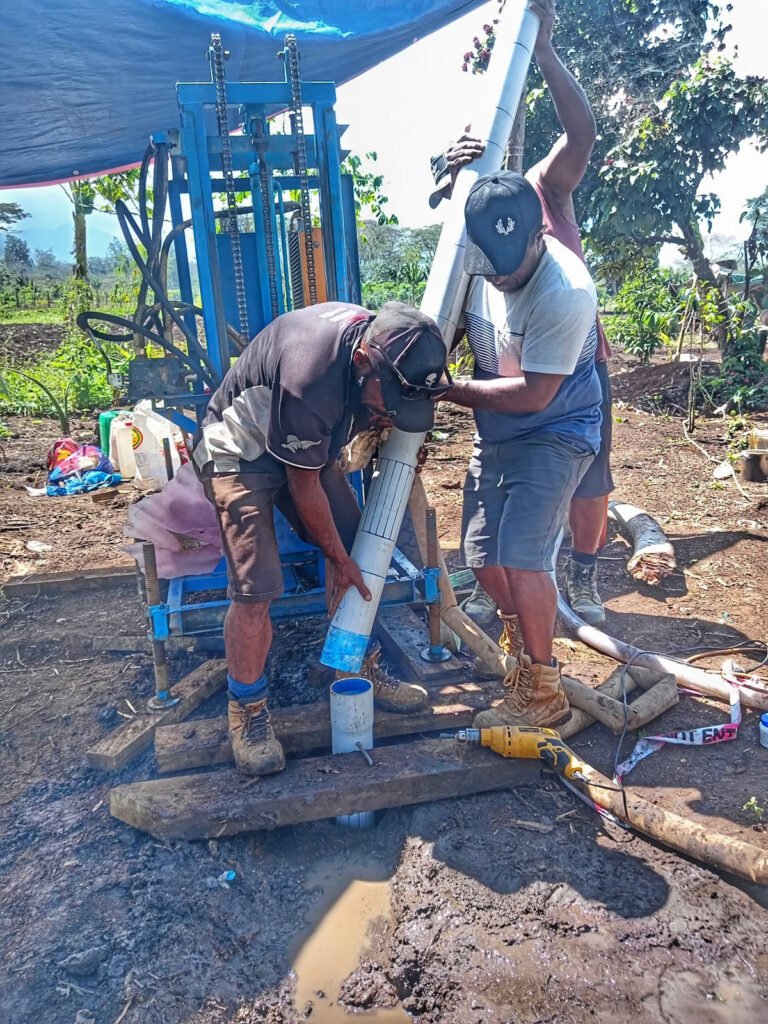 Bore water PVC casing being run